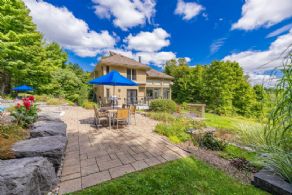 Dining area alongside pool and garden - Country homes for sale and luxury real estate including horse farms and property in the Caledon and King City areas near Toronto
